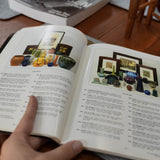 20th Century Art & Design auction catalogue, held in a hand for scale