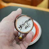 DeSimone hand-painted espresso cups and saucers, close view of the mark and material