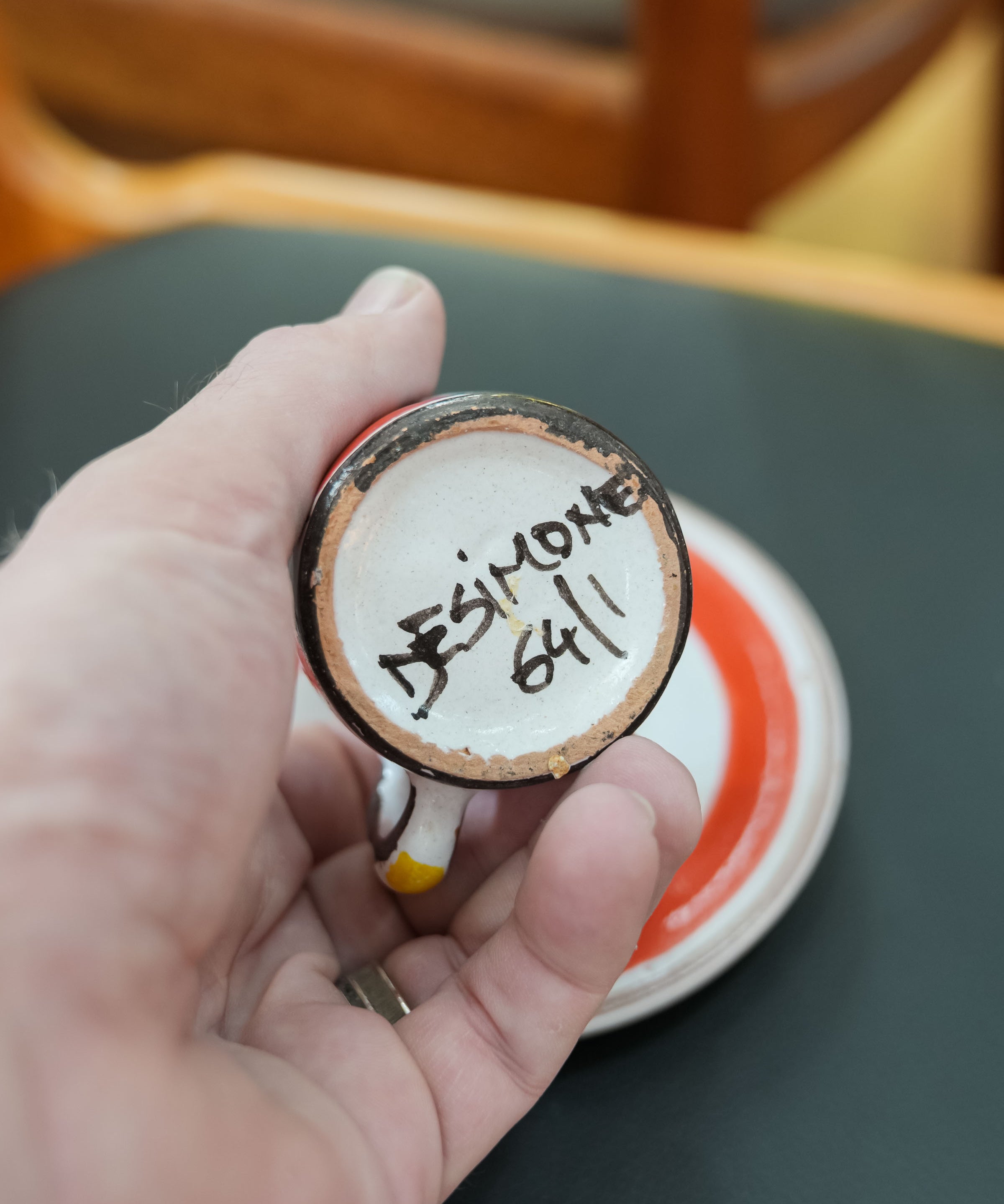 DeSimone hand-painted espresso cups and saucers, close view of the mark and material