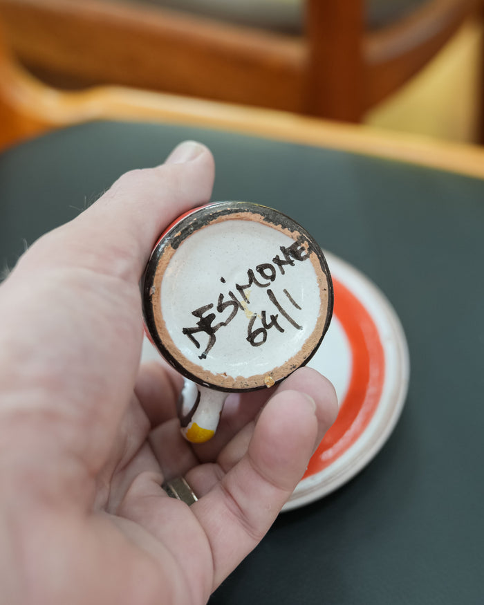 Each cup is signed DeSimone with the numbers 64/1 on the base.