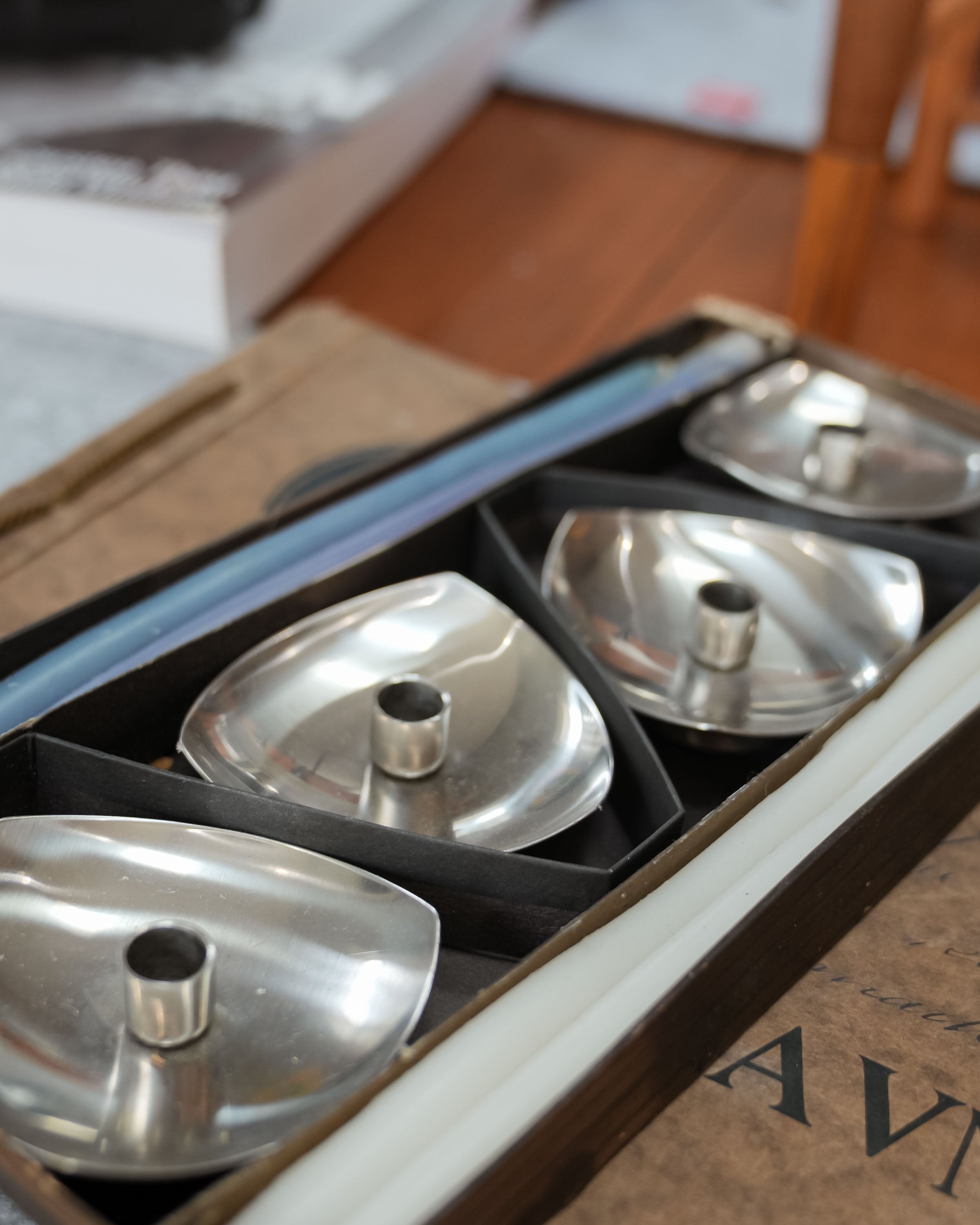 Stelton stainless steel candle holders, set of four, close view of the mark and material