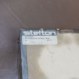 Stelton Stainless Steel Candle Holders, Set of 4, with Candles, close view of the maker's mark