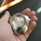 Stelton stainless steel nut dishes, set of four, close view of the mark and material