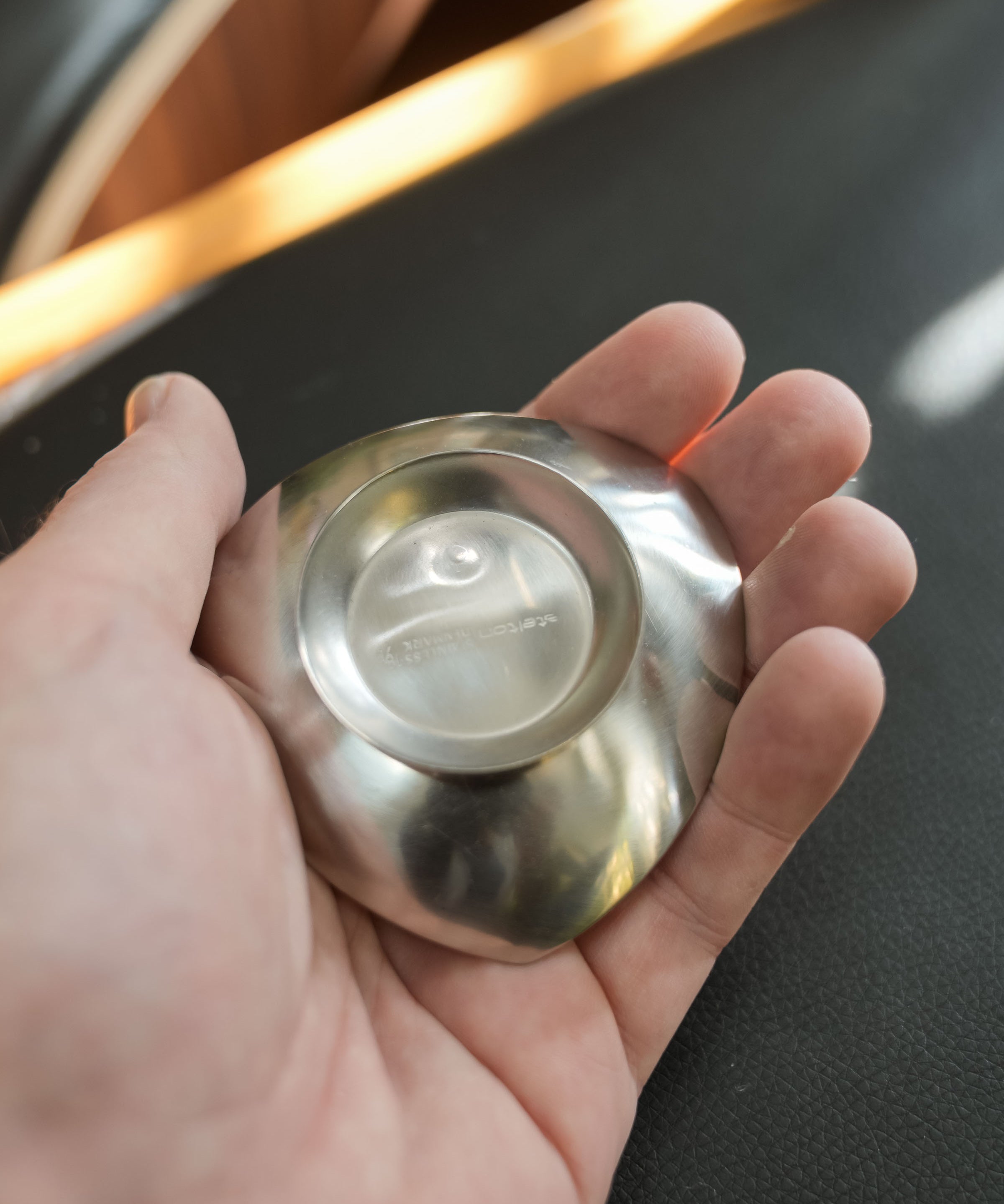 Stelton stainless steel nut dishes, set of four, close view of the mark and material
