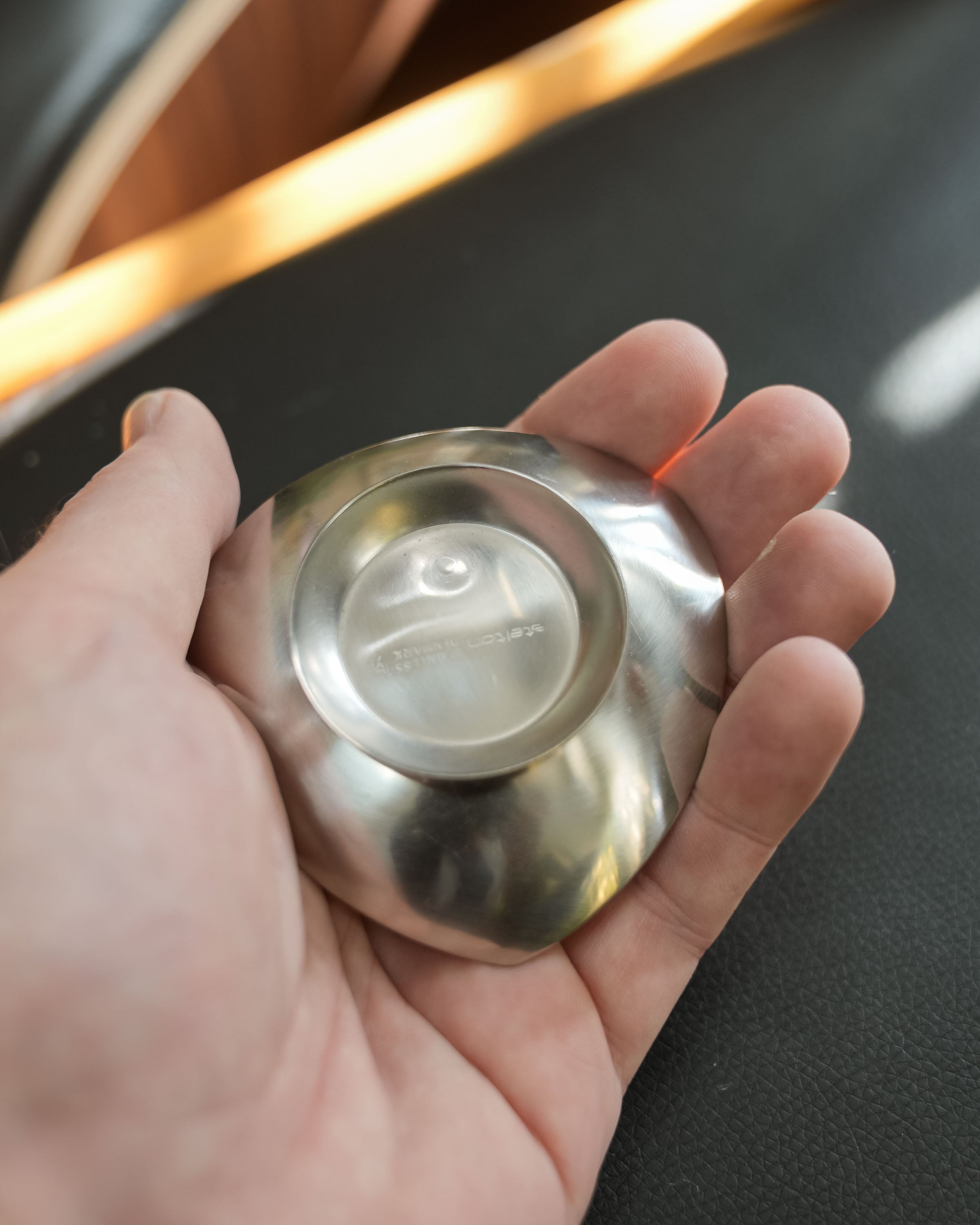 Stelton stainless steel nut dishes, set of four, close view of the mark and material
