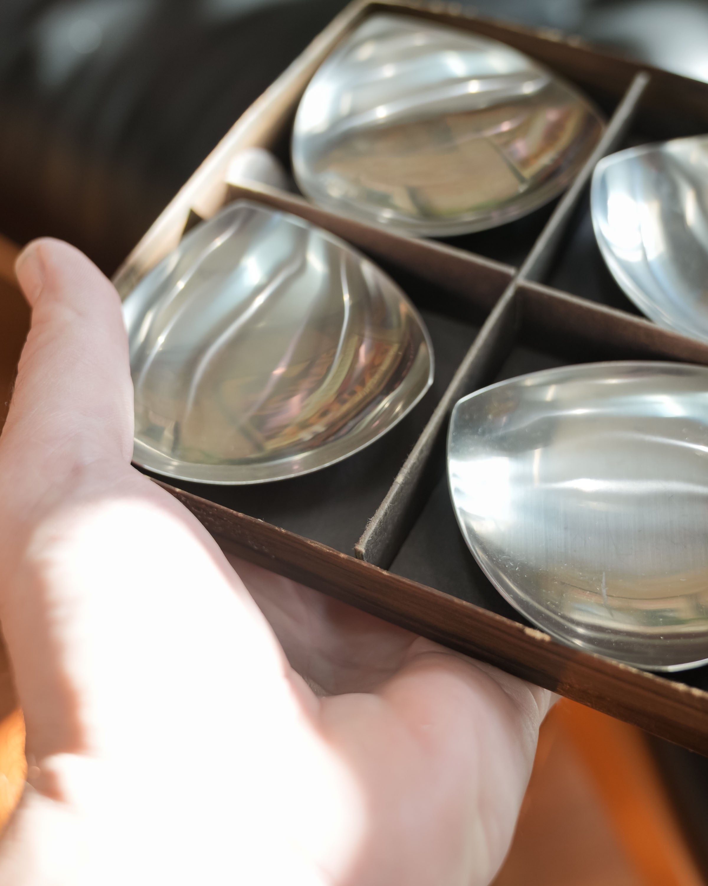 Stelton stainless steel nut dishes, set of four, held in a hand for scale