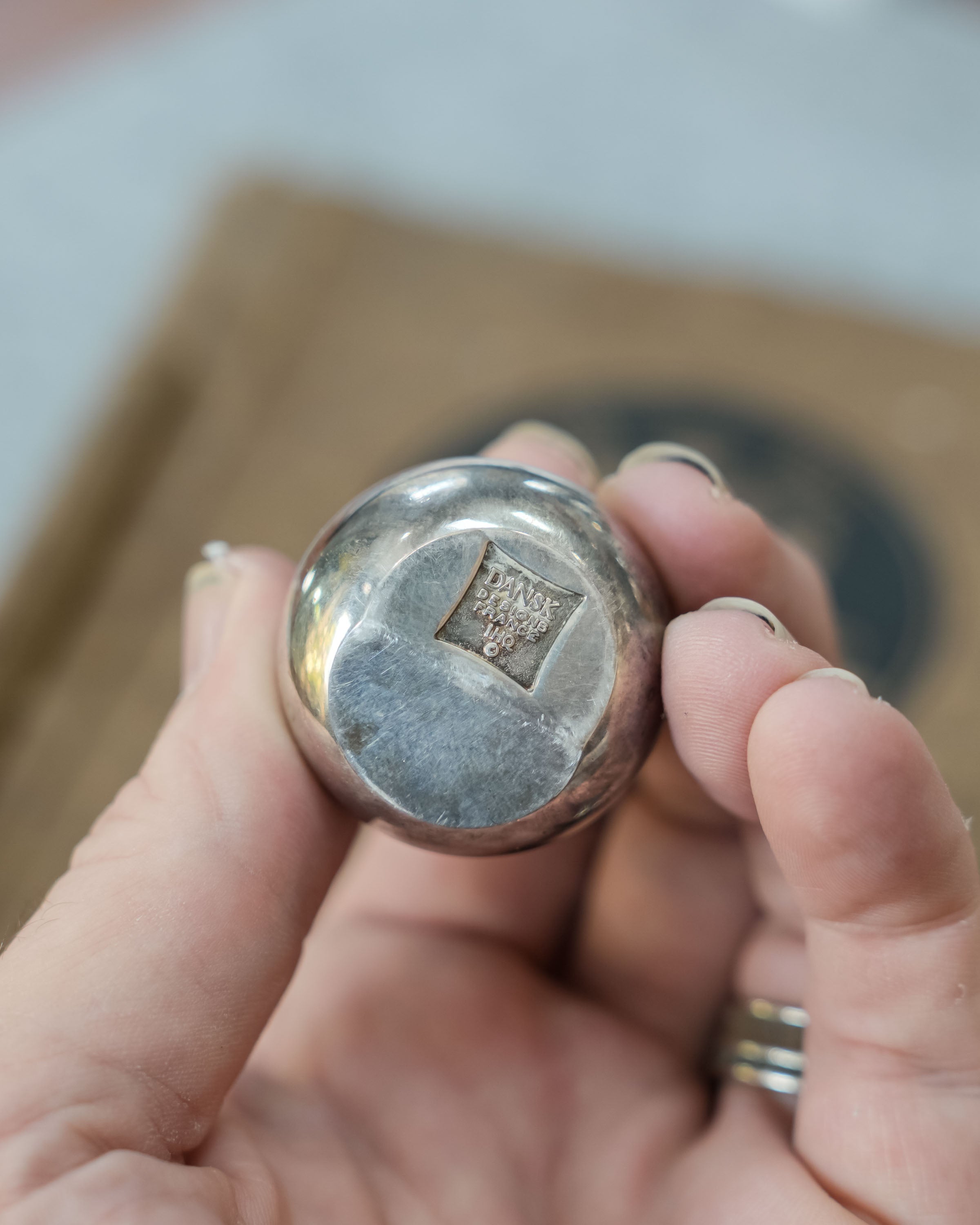 Dansk silverplate teardrop candleholders by Jens Quistgaard, close view of the mark and material
