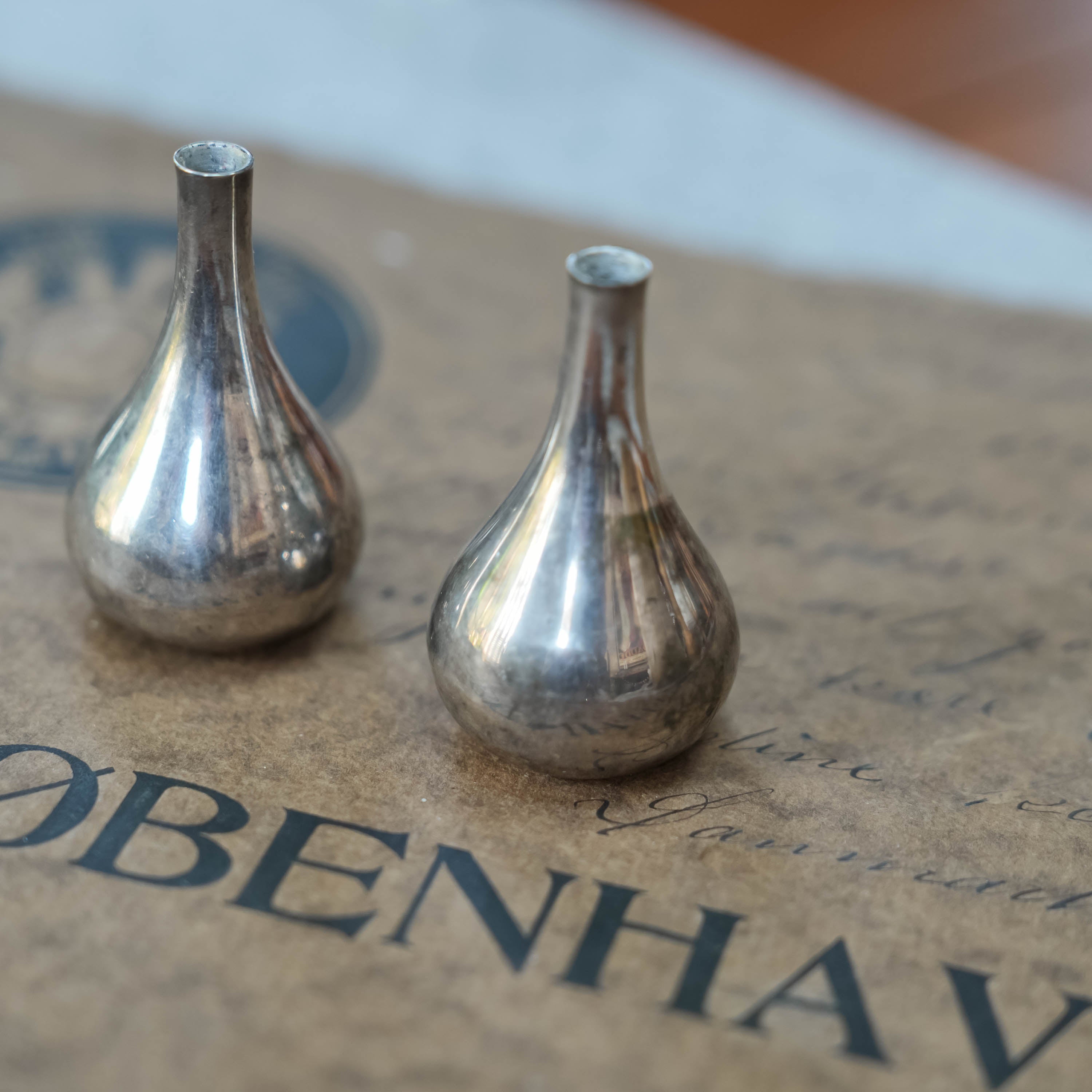 Dansk silverplate teardrop candleholders by Jens Quistgaard, in context on the table