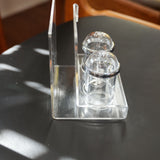 Acrylic salt and pepper shakers with napkin holder, close view of the mark and material