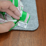 Vera scarf, green and white circles, close view of the mark and material