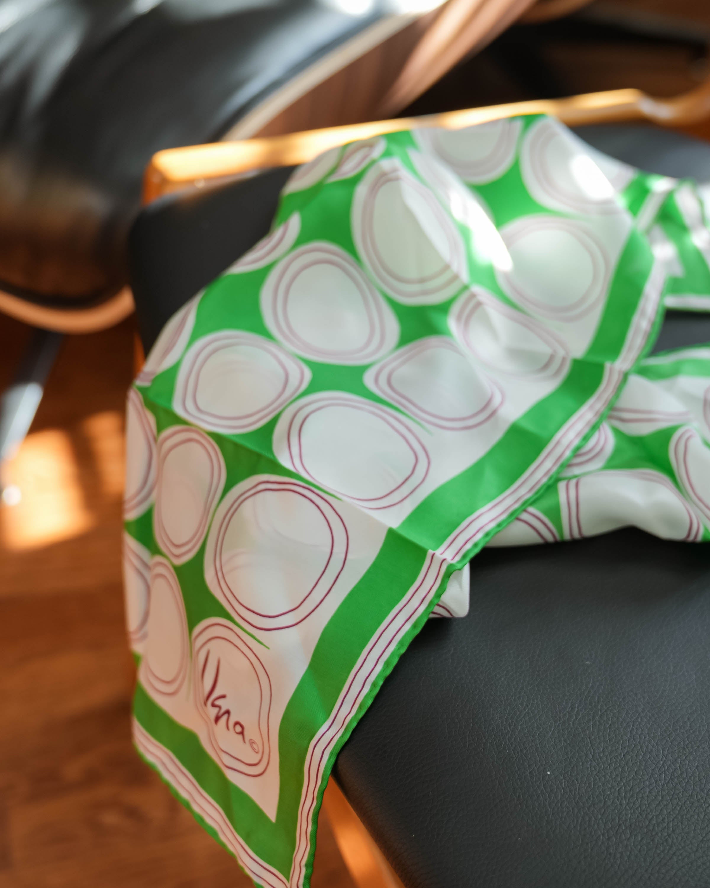 Vera scarf, green and white circles, in use
