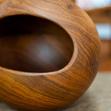 Söwe Konst teak orb nut bowl, close view of the teak grain and turned rim